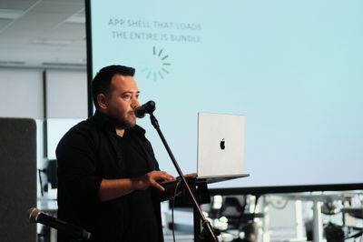 Image of a speaker giving a talk at tim.js meetup